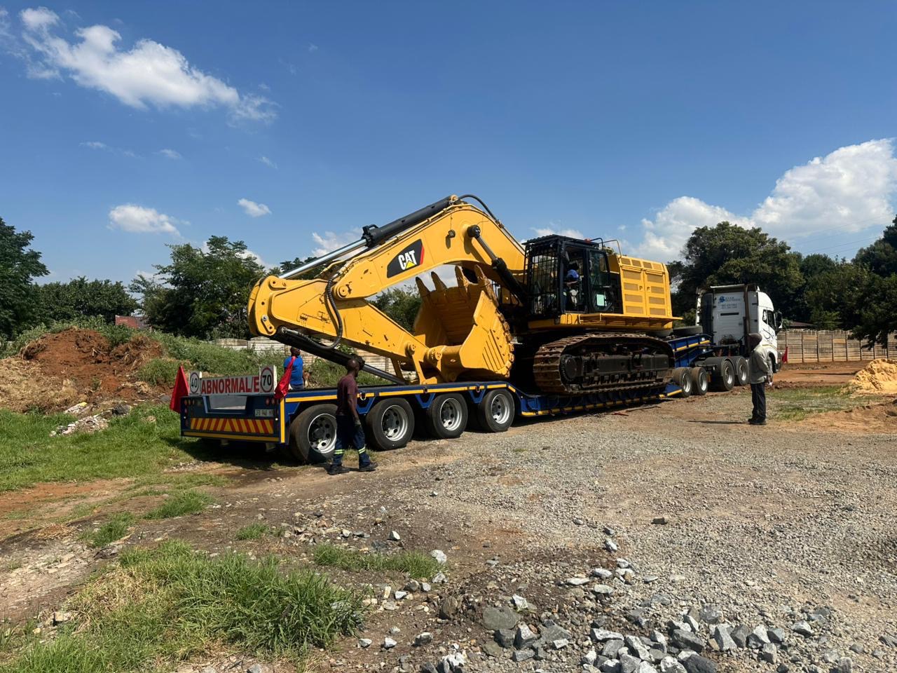 CAT 6015 excavator transported on an abnormal-load lowbed