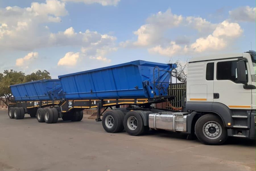 Side tipper interlink truck and trailers